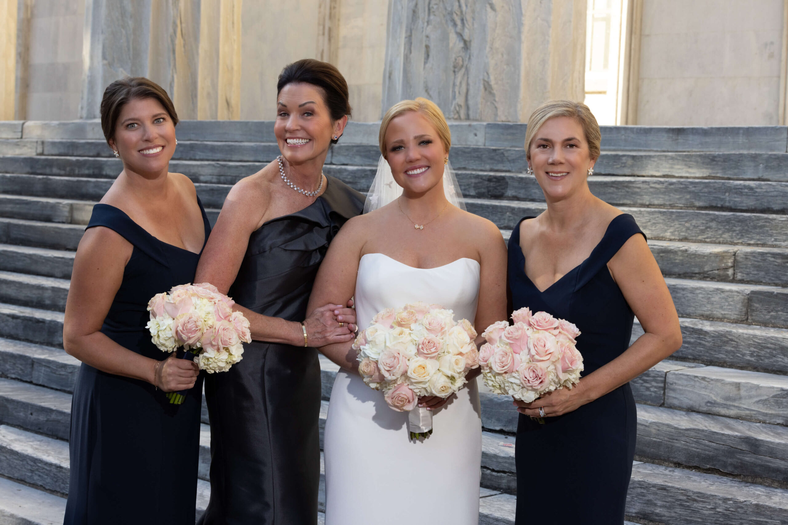 a woman in a flowy dress playing the violin between two abandoned trains
