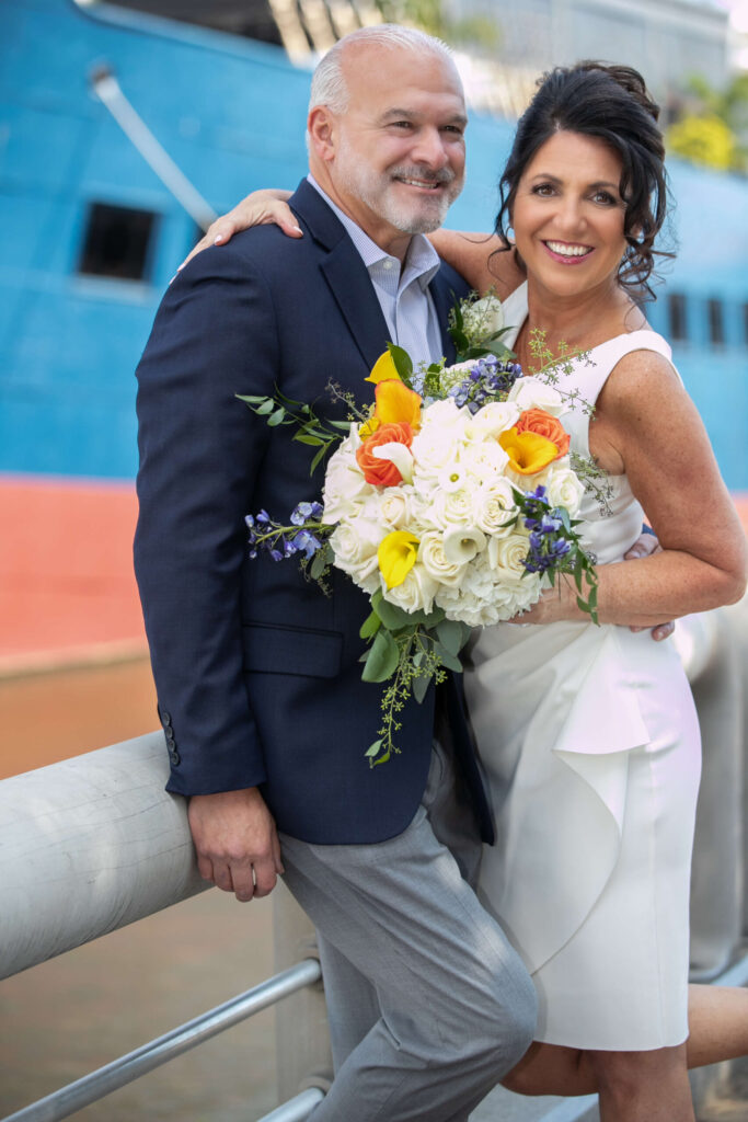 casual bride and groom posing together for wedding photos at the moshulu in philly
