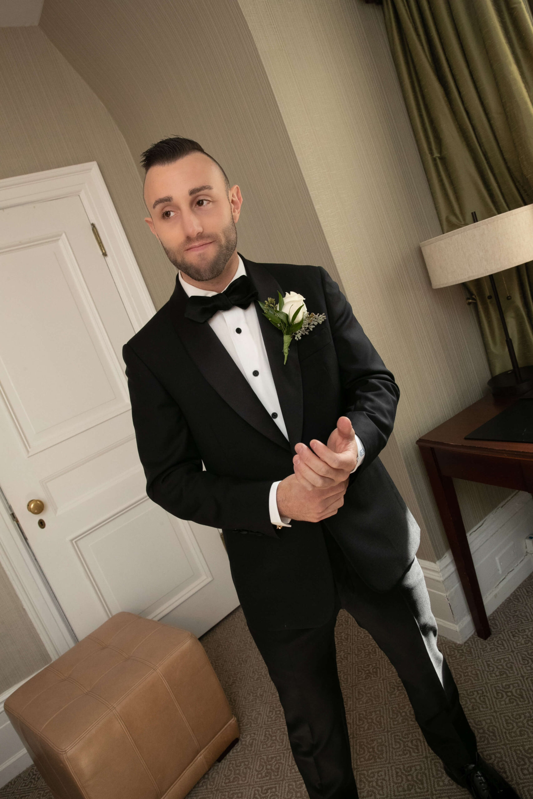 bride and groom romantically embracing one another at museum of art in philadelphia