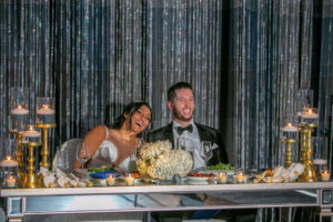 bride and groom laughing at sweet heart table at w hotel in philadelphia