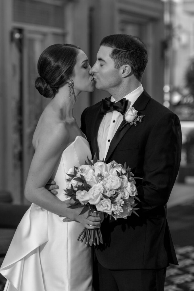 bride and groom kissing at the willard hotel