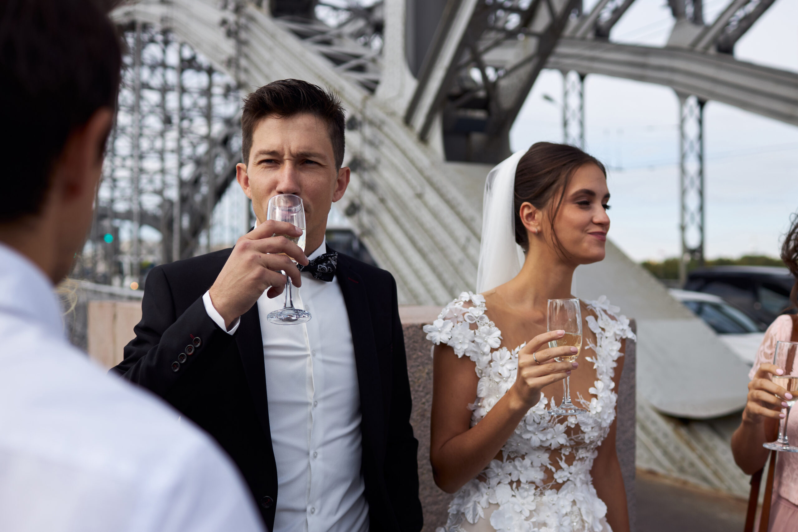 an exciting champagne pop with a bride and groom in the courtyard at The Logan in Philadelphia