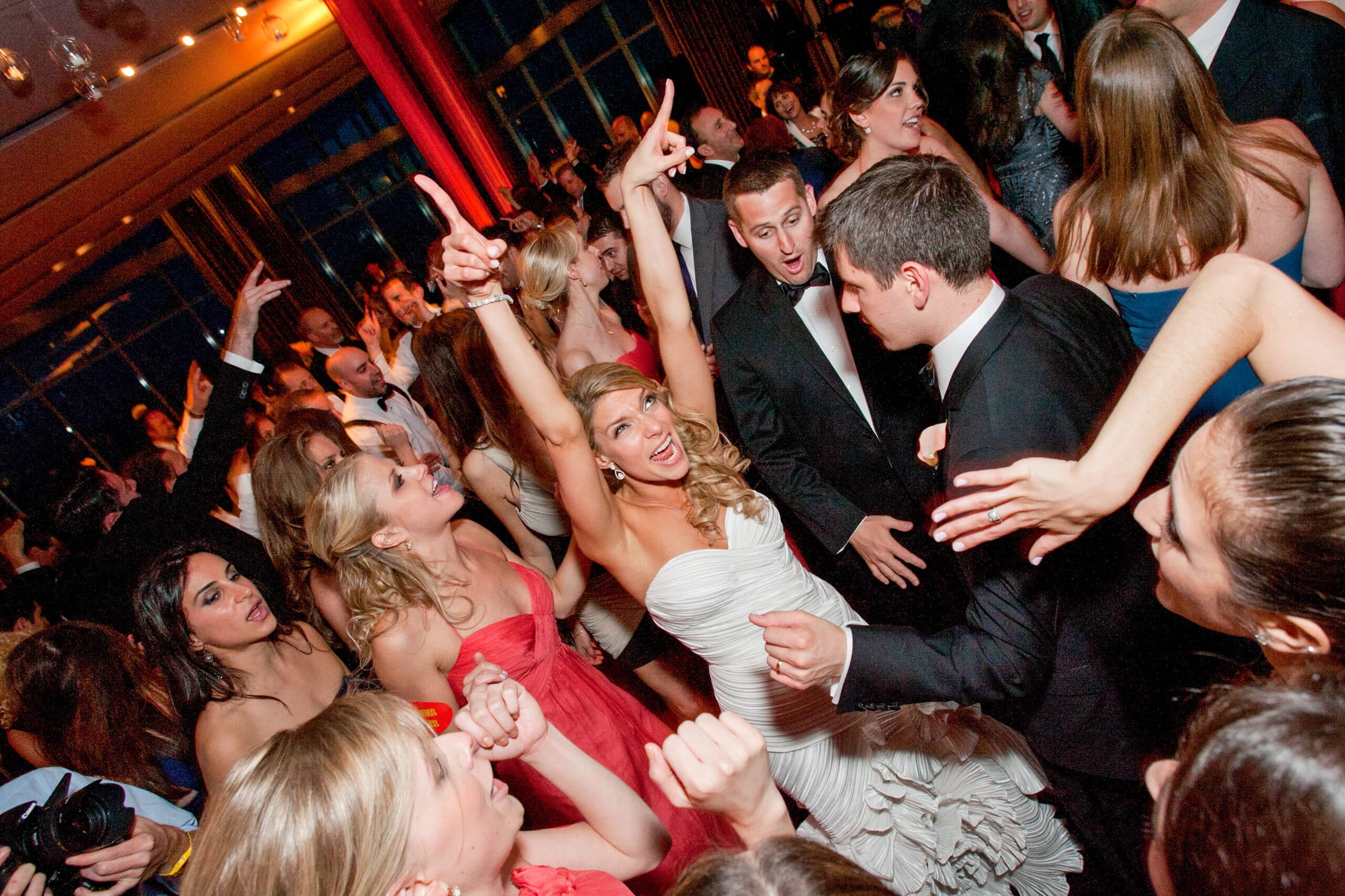 bride and groom embracing with AC skyline in the back