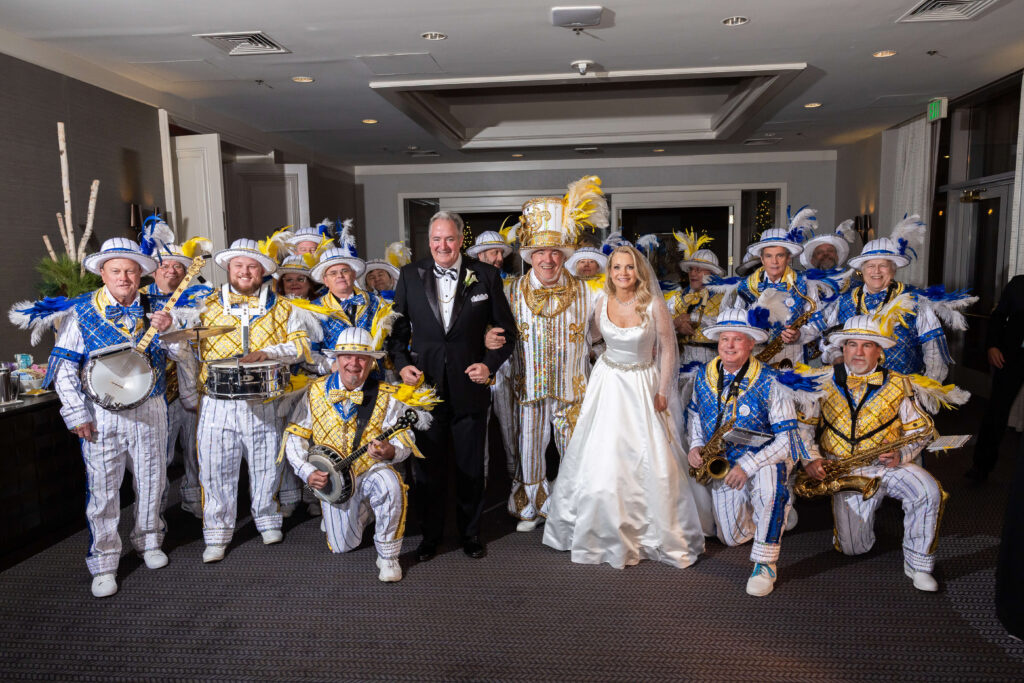 Bride and groom dancing with the Quaker City String Band Mummers during a Logan Hotel wedding reception in Philadelphia