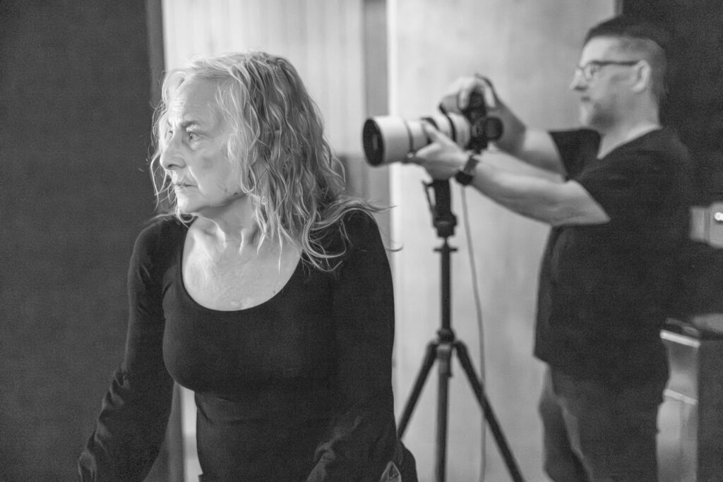 behind the scenes of photography team on set working at an indoor studio