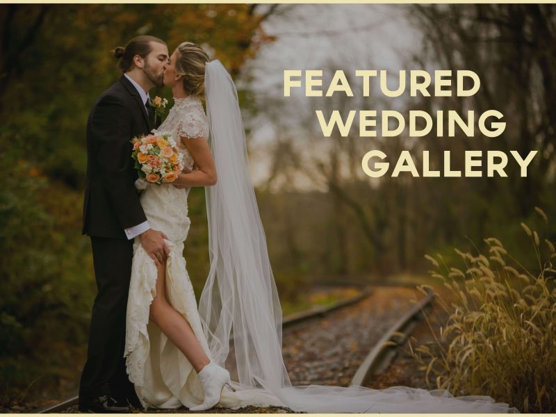 bride and groom kissing at the train tracks in the woods