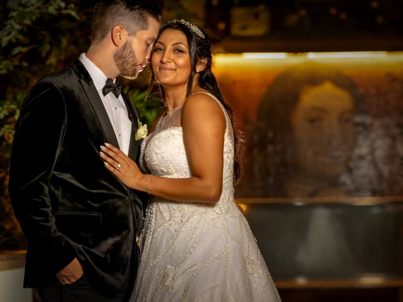 bride and groom embrace at w hotel in philadelphia in secret garden