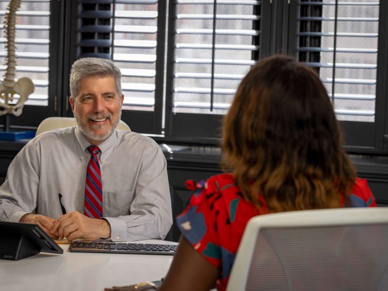 doctor consulting with patient in conference room